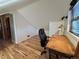 Cozy office space with wooden desk and chair and ample natural light at 26212 Center Dr, Kittredge, CO 80457