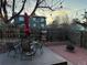 Backyard patio featuring a fire pit, brick pavers, a dining set, and outdoor seating at 26212 Center Dr, Kittredge, CO 80457