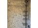 Close-up of the tiled shower with mounted caddy and adjustable shower head at 26212 Center Dr, Kittredge, CO 80457