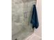 A closer look at the alcove shower, featuring marble tiling and a glass door with chrome handle at 26212 Center Dr, Kittredge, CO 80457