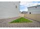 Landscaped backyard featuring rock ground cover and small triangle of grass at 3934 N Quatar Ct, Aurora, CO 80019