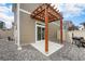 Outdoor patio featuring a wood pergola, rock ground cover, and gas grill at 3934 N Quatar Ct, Aurora, CO 80019