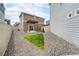 Large backyard with wood pergola, gravel landscaping, and fenced yard at 3934 N Quatar Ct, Aurora, CO 80019