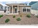 Home exterior featuring manicured landscaping, a covered porch, and a well-maintained facade at 3934 N Quatar Ct, Aurora, CO 80019