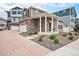 Inviting home exterior showcasing stone accents, manicured landscaping, and a covered porch at 3934 N Quatar Ct, Aurora, CO 80019