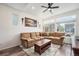 Spacious living room features a large sectional sofa, and big windows with lots of light at 3934 N Quatar Ct, Aurora, CO 80019