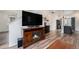 Living room features a fireplace and a large screen TV at 3934 N Quatar Ct, Aurora, CO 80019