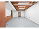 Unfinished basement with open ceiling, concrete floor, and built-in shelves for storage at 466 S Kingston Cir, Aurora, CO 80012