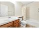 Clean bathroom featuring a single sink vanity, toilet, and a shower-tub combination at 466 S Kingston Cir, Aurora, CO 80012