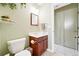 Well-maintained bathroom with a vanity, a toilet, and neutral-toned walls at 466 S Kingston Cir, Aurora, CO 80012