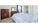 Bedroom view including dressers, view of the vanity, walk in closet, and doorway at 466 S Kingston Cir, Aurora, CO 80012