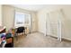 Simple bedroom setup with natural light and a desk for a versatile living space at 466 S Kingston Cir, Aurora, CO 80012