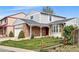 Charming two-story home with brick accents, a well-maintained lawn, and a delightful bay window at 466 S Kingston Cir, Aurora, CO 80012