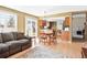 Living and dining space with natural light, seamlessly connecting to the kitchen for open living at 466 S Kingston Cir, Aurora, CO 80012