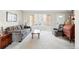 Comfortable living room with a large bay window, plush sofa, and a cozy armchair at 466 S Kingston Cir, Aurora, CO 80012