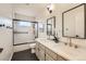 Bathroom with a double sink vanity, shower and modern finishes at 3549 Mallard Dr, Highlands Ranch, CO 80126