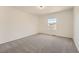 This bedroom features neutral walls, carpet, and a window with lovely light at 3549 Mallard Dr, Highlands Ranch, CO 80126