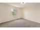 This bedroom features neutral walls, carpet, and a bright window at 3549 Mallard Dr, Highlands Ranch, CO 80126