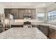 Close-up of kitchen showcasing granite countertops, stainless steel appliances, and modern fixtures at 3549 Mallard Dr, Highlands Ranch, CO 80126