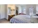 Bedroom with natural light, ensuite bathroom, a comfortable bed, and sitting area at 820 Kimbark St # B, Longmont, CO 80501