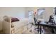 Bright bedroom with a bed, desk, office chair and natural light from the window at 820 Kimbark St # B, Longmont, CO 80501