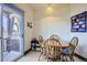 Cozy dining area with a wooden table, chairs, and access to a balcony at 820 Kimbark St # B, Longmont, CO 80501
