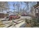 Spacious driveway with multiple parking spaces, bordered by mature trees and greenery at 820 Kimbark St # B, Longmont, CO 80501