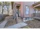 Inviting entrance featuring wooden steps and a decorative glass front door at 820 Kimbark St # B, Longmont, CO 80501