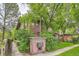 Property sign with a view of the surrounding greenery and charming building exterior at 820 Kimbark St # B, Longmont, CO 80501
