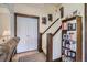 Inviting foyer showcasing a staircase, bookcase, and double door closet for ample storage at 820 Kimbark St # B, Longmont, CO 80501