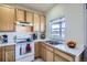 Functional kitchen with bright cabinets and a window overlooking the street at 820 Kimbark St # B, Longmont, CO 80501