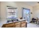 Kitchen with a double sink, window, and a sliding glass door with access to an outdoor space at 820 Kimbark St # B, Longmont, CO 80501