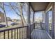 Charming porch with wood railing, offering neighborhood views and a cozy outdoor space at 820 Kimbark St # B, Longmont, CO 80501