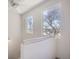Bright stairwell with natural light from two windows and featuring a modern ceiling fan at 820 Kimbark St # B, Longmont, CO 80501