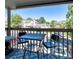 Balcony showcasing a bistro table set and neighborhood views at 9640 W Chatfield Ave # A, Littleton, CO 80128