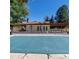 Community pool with covered patio and ample space for lounging at 9640 W Chatfield Ave # A, Littleton, CO 80128