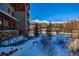 Winter view of building with mountain backdrop at 600 Columbine Rd # 5207, Breckenridge, CO 80424