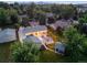Spacious backyard features a patio, fire pit, string lights, detached garage, and landscaping at 1260 Hoyt St, Lakewood, CO 80215