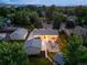 Large backyard with patio, outdoor seating, a fire pit, landscaping, detached garage and shed at 1260 Hoyt St, Lakewood, CO 80215