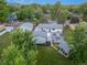Large backyard with detached garage, landscaping, a patio, fire pit, and seating at 1260 Hoyt St, Lakewood, CO 80215