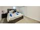 Cozy bedroom featuring comfy bed with stylish bedding, bedside tables, and closet at 1260 Hoyt St, Lakewood, CO 80215