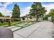 Charming single-story home featuring a landscaped front yard, modern driveway, and a welcoming entrance at 1260 Hoyt St, Lakewood, CO 80215