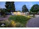 Charming single-story home featuring a landscaped front yard, modern driveway, and pathway lighting at 1260 Hoyt St, Lakewood, CO 80215