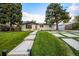 Charming single-story home featuring a landscaped front yard, modern driveway, and welcoming entrance at 1260 Hoyt St, Lakewood, CO 80215