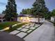 Charming single-story home featuring a landscaped front yard, modern driveway, and pathway lighting at 1260 Hoyt St, Lakewood, CO 80215