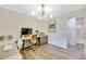 Bright home office with modern lighting, dual desks and grey storage cabinets at 1260 Hoyt St, Lakewood, CO 80215