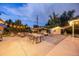 Outdoor patio at dusk boasts cozy seating, string lights, and a fire pit for entertaining guests at 1260 Hoyt St, Lakewood, CO 80215