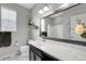 This bathroom features decorative floating shelves, marble counter tops, and a shower at 19210 E Pacific Pl, Aurora, CO 80013