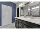 Contemporary bathroom showcasing double sinks, marble countertops, and a walk-in shower at 19210 E Pacific Pl, Aurora, CO 80013