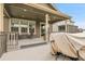 Partially covered deck with a table and sofa set, perfect for entertaining at 19210 E Pacific Pl, Aurora, CO 80013